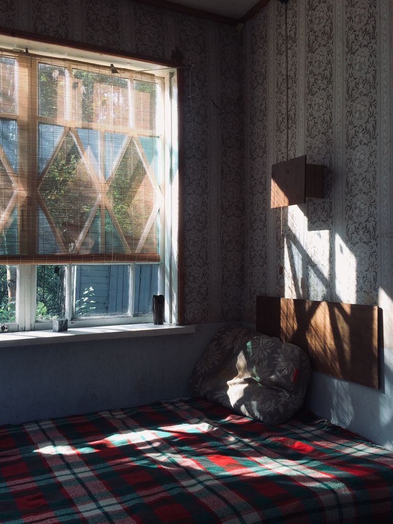 Sun-facing window with heat-blocking film reducing afternoon heat