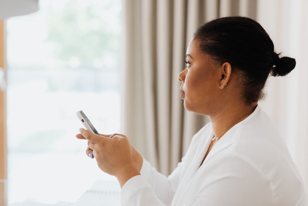 Woman checking WhatsApp storage full warning on her smartphone