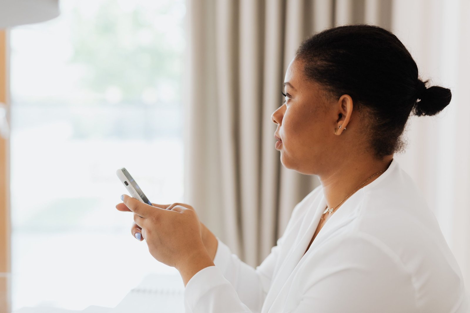 Woman checking WhatsApp storage full warning on her smartphone