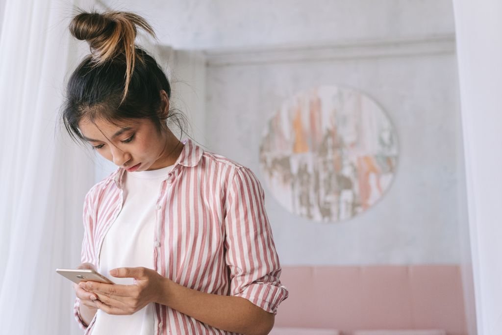 Woman checking why her phone storage is full